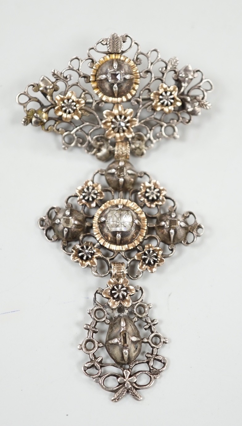 A continental antique pierced white and yellow metal, diamond set three tier drop brooch, 70mm, gross weight 13.2 grams.